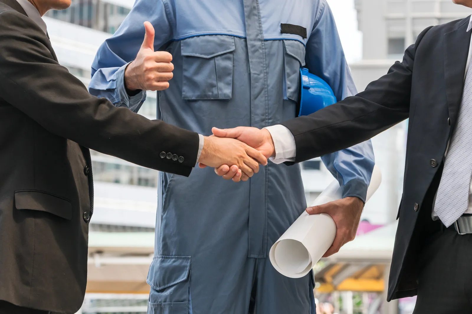 A handshake between a business owner and a tradesman